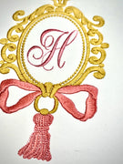 OVAL FRAME WITH TASSEL AND BOW