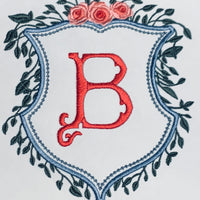 CREST WITH GREENERY AND FLORAL TOP